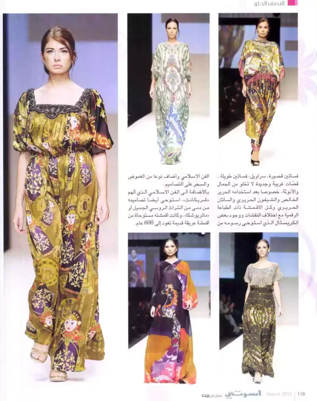 Models on the runway wearing a collection of Shrekahnth’s digitally printed kaftans and dresses at Dubai Fashion Week, showcasing Russian doll motifs, Islamic art references, and vibrant patterns in flowing fabrics.